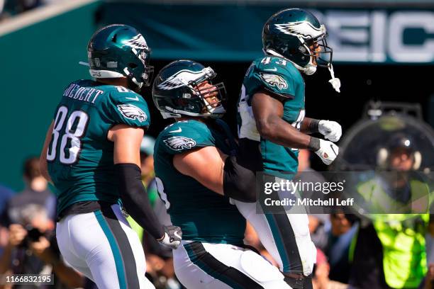 Darren Sproles of the Philadelphia Eagles celebrates with Dallas Goedert and Lane Johnson after converting a two point conversion in the fourth...