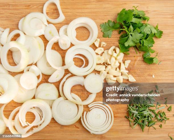 onion,garlic, parsley and rosemary - chopping garlic stock pictures, royalty-free photos & images