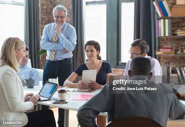business team having a meeting - west new york nueva jersey fotografías e imágenes de stock