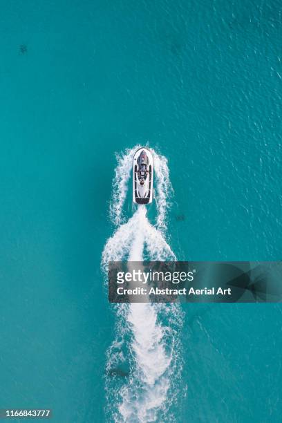 jet ski at sea shot from directly above, barbados - speedboat foto e immagini stock