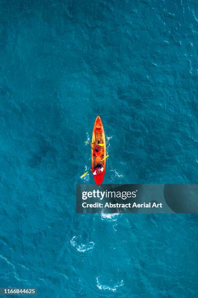 single kayak in the ocean, barbados - canoe fotografías e imágenes de stock