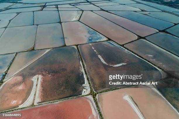 aerial perspective of salt storage ponds, gruissan, france - aude imagens e fotografias de stock