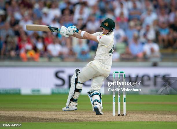 Steve Smith of Australia gets hit on the helmet by Ben Stokes of England during day three of the First Ashes test match at Edgbaston on August 3,...