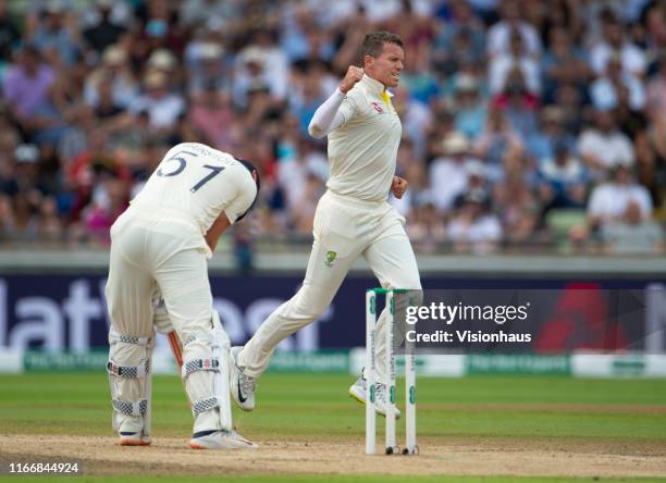 Peter Siddle of Australia celebrates taking the wicket of Jonny Bairstow of England during day three of the First Ashes test match at Edgbaston on...