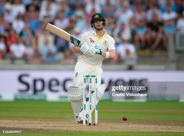 Steve Smith of Australia gets hit on the helmet by Ben Stokes of England during day three of the First Ashes test match at Edgbaston on August 3,...