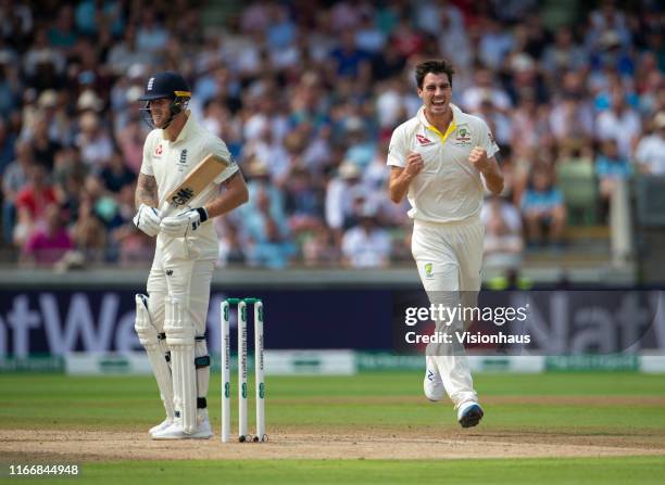 Pat Cummins of Australia celebrates taking the wicket of Ben Stokes of England during day three of the First Ashes test match at Edgbaston on August...