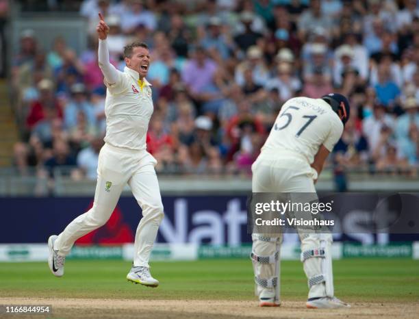 Peter Siddle of Australia celebrates taking the wicket of Jonny Bairstow of England during day three of the First Ashes test match at Edgbaston on...