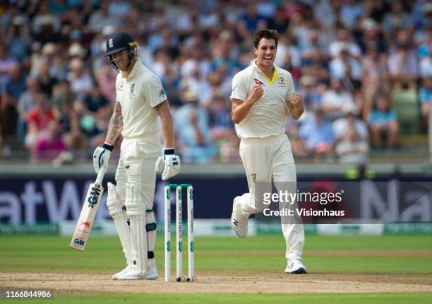 Pat Cummins of Australia celebrates taking the wicket of Ben Stokes of England during day three of the First Ashes test match at Edgbaston on August...