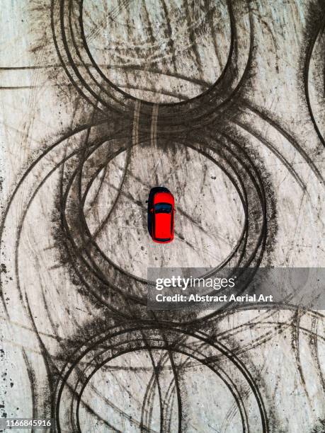 tire tracks and a vehicle on a beach as seen from above, france - sand art stock pictures, royalty-free photos & images