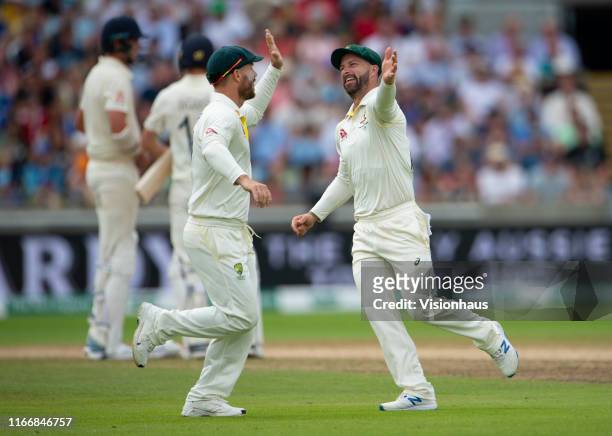 Matthew Wade and David Warner of Australia high five during day three of the First Ashes test match at Edgbaston on August 3, 2019 in Birmingham,...