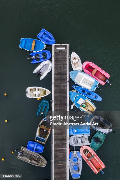 Small boats moored at a pier shot from directly above, France