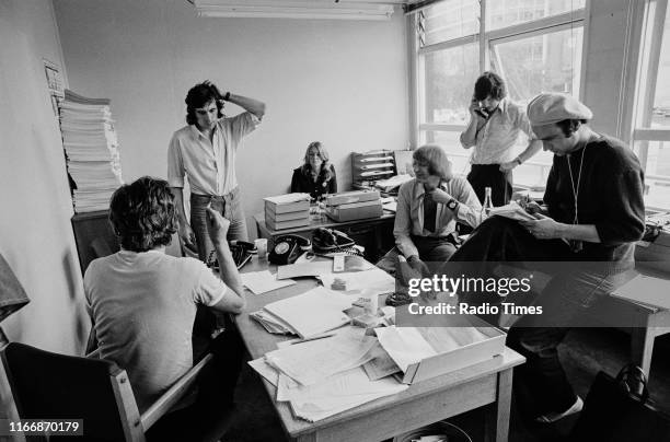 Writers Ian MacNaughton, Terry Jones, unknown, Graham Chapman, Michael Palin and Neil Innes in a script conference for BBC television show 'Monty...