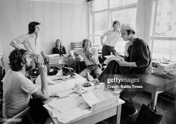 Writers Ian MacNaughton, Terry Jones, unknown, Graham Chapman, Michael Palin and Neil Innes in a script conference for BBC television show 'Monty...