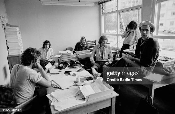 Writers Ian MacNaughton, Terry Jones, unknown, Graham Chapman, Michael Palin and Neil Innes in a script conference for BBC television show 'Monty...