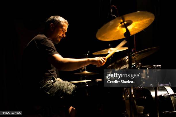 drummer playing drums in the music recording studio - drummer stock pictures, royalty-free photos & images