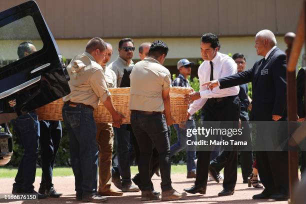 Pallbearers carry the casket of Elsa Mendoza Marquez, a Mexican schoolteacher and principal who was killed in the El Paso mass shooting, before her...