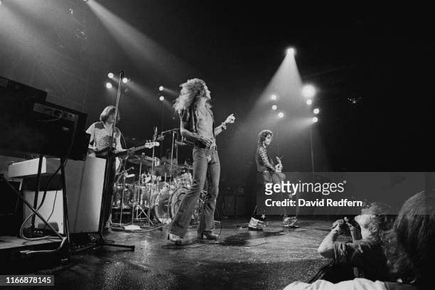 From left, bassist John Paul Jones, drummer John Bonham, singer Robert Plant and guitarist Jimmy Page perform live on stage during a concert by...