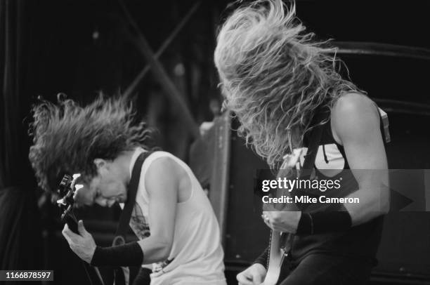 Bassist Jason Newsted and singer and guitarist James Hetfield of American heavy metal band Metallica in concert at the Monsters of Rock Festival at...
