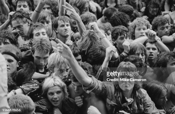 Fans of American heavy metal band Metallica watch them perform at the Monsters of Rock Festival at Castle Donington, England, 22nd August 1987.