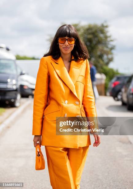 Babba Rivera is seen wearing orange suit outside By Malene Birger during Copenhagen Fashion Week Spring/Summer 2020 on August 08, 2019 in Copenhagen,...