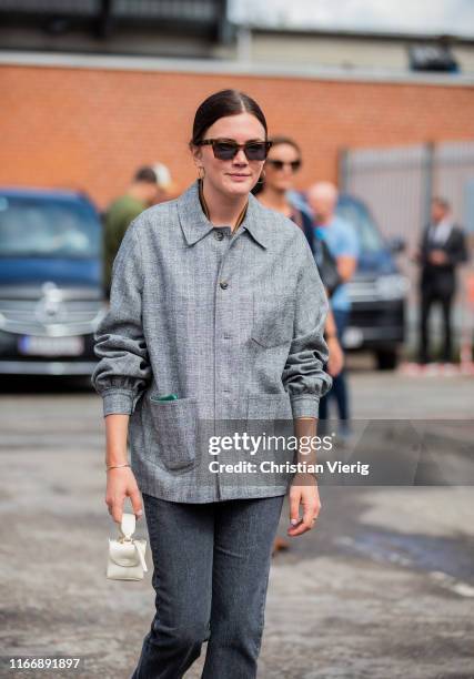 Madelynn Furlong is seen wearing grey plaid jacket outside By Malene Birger during Copenhagen Fashion Week Spring/Summer 2020 on August 08, 2019 in...