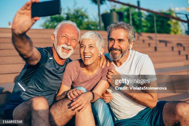 cheerful mature friends taking selfie after working out - 3 old men jogging stock pictures, royalty-free photos & images