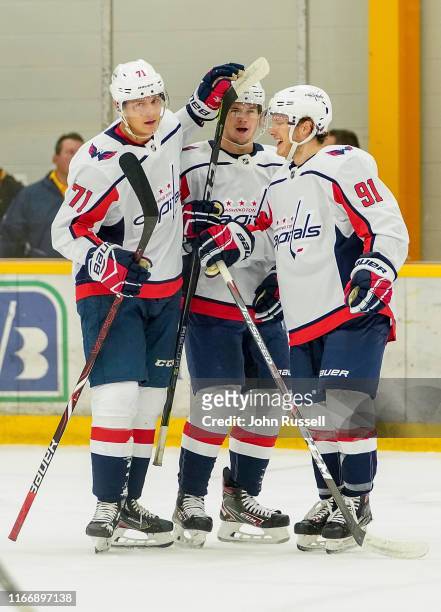 Kody Clark, Connor McMichael and Joe Snively the Washington Capitals celebrate a goal against the Nashville Predators during an NHL Prospects game at...