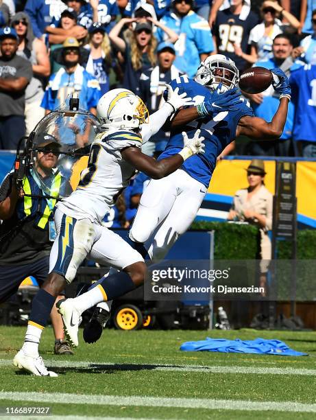 Wide receiver Devin Funchess of the Indianapolis Colts is unable to catch a touchdown pass as he is defended by defensive back Brandon Facyson of the...