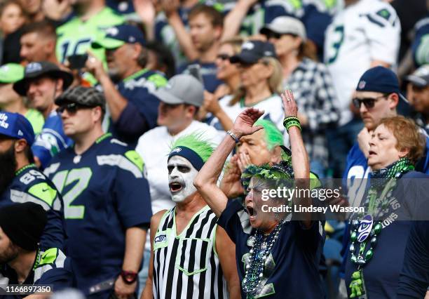 Fans scream as the Cincinnati Bengals start a play in the red zone against the Seattle Seahawks in the fourth quarter at CenturyLink Field on...