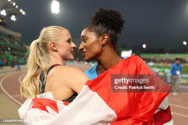 Sage Watson of Canada hugs Anna Cockrell of United States after competing in Women’s 400m Hurdles Final on Day 13 of Lima 2019 Pan American Games at...