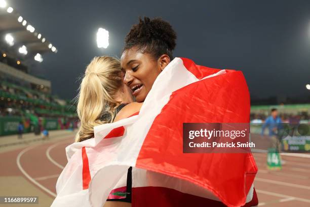 Sage Watson of Canada hugs Anna Cockrell of United States after competing in Women’s 400m Hurdles Final on Day 13 of Lima 2019 Pan American Games at...