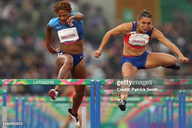 Sharika Nelvis of United States and Andrea Vargas of Costa Rica compete in Women's 100m Hurdles Final on Day 13 of Lima 2019 Pan American Games at...