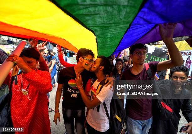 Young Gay couple of LGBT Community kiss during the Queer march. The historic verdict on partial decriminalization of Section 377 which came on 6th...