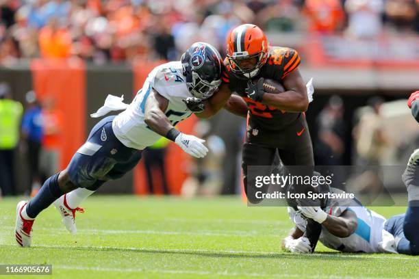 Tennessee Titans linebacker Rashaan Evans and Tennessee Titans linebacker Jayon Brown combine to tackle Cleveland Browns running back Nick Chubb...