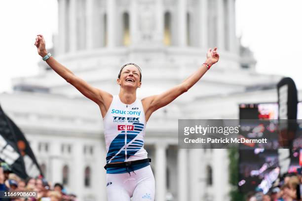Linsey Corbin of the United States celebrates after winning the Pro Women's Division of the IRONMAN Wisconsin on September 8, 2019 in Madison,...