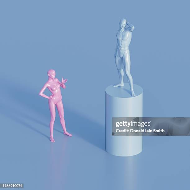 gender inequality: man on blue pedestal standing above woman - gender symbol stock pictures, royalty-free photos & images