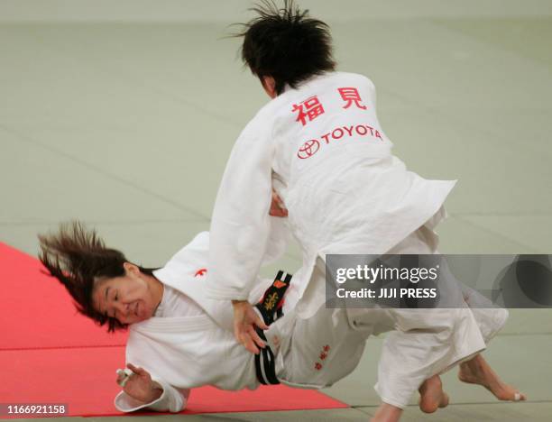 By Shigemi Sato Ryoko Tani is thrown down by Tomoko Fukumi during their women's 48-kilogram final of Japan's national judo championships in Fukuoka...