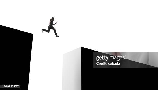 Businessman jumping from obstacles of life
