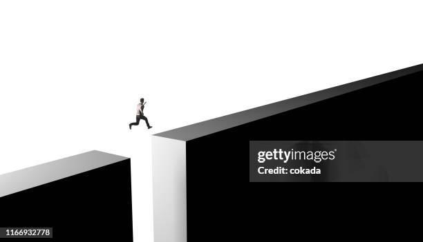 businessman jumping from obstacles of life - right path stock pictures, royalty-free photos & images