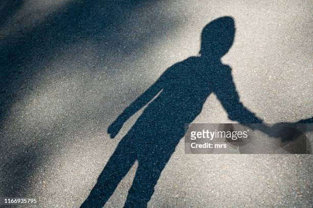shadow of a boy - childhood stock pictures, royalty-free photos & images