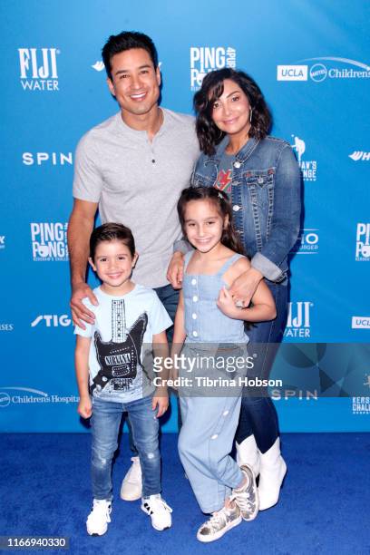 Mario Lopez, Courtney Laine Mazza, Dominic Lopez and Gia Lopez attend Clayton Kershaw's 7th Annual Ping Pong 4 Purpose at Dodger Stadium on August...