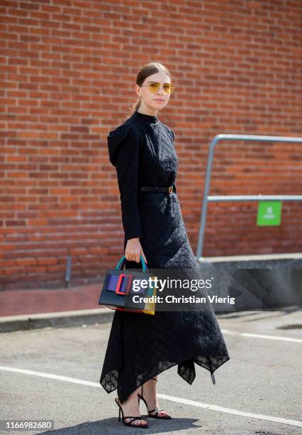 Swantje Sömmer is seen wearing black dress, multi colored Boyy bag outside By Malene Birger during Copenhagen Fashion Week Spring/Summer 2020 on...