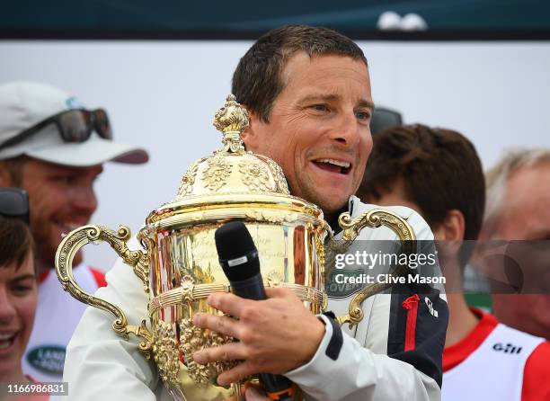 Bear Grylls and his crew competing on behalf of Tusk are presented with the Kings Cup after winning the inaugural King’s Cup regatta hosted by the...