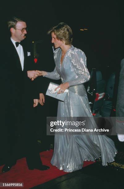 Diana, Princess of Wales attends a Bruce Oldfield fashion show at the Grosvenor House Hotel in London, wearing a dress by Oldfield, March 1985.