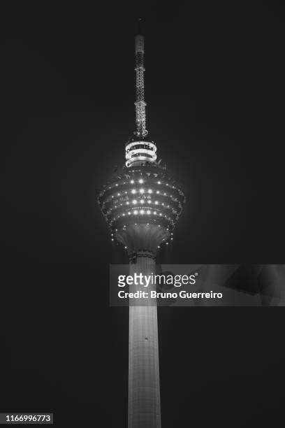 kl tower against night sky - menara kuala lumpur tower stock pictures, royalty-free photos & images