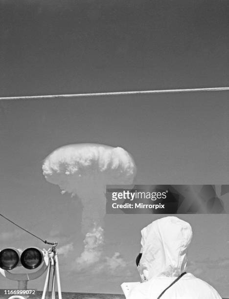 Mushroom cloud rises over the Pacific moments after the detonation of Britain's second Hydrogen bomb. As seen by members of the press and naval...
