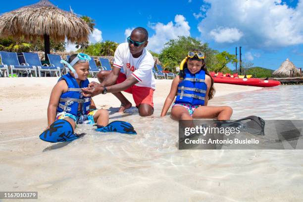 kids playing on a caribbean beach - honduras family stock pictures, royalty-free photos & images