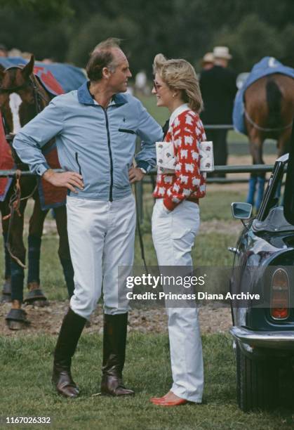 Diana, Princess of Wales with Major Ronald Ferguson at a polo match at Smith's Lawn, Guards Polo Club, Windsor, June 1983. Diana is wearing a Muir...