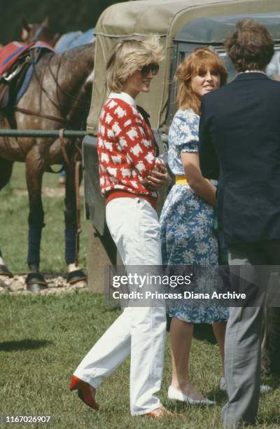 Diana, Princess of Wales and her friend Sarah Ferguson attend a polo match at Smith's Lawn, Guards Polo Club, Windsor, June 1983. Diana is wearing a...