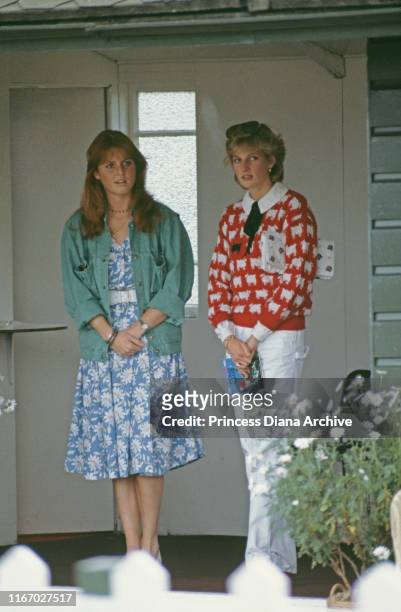 Diana, Princess of Wales with her friend Sarah Ferguson at a polo match at Smith's Lawn, Guards Polo Club, Windsor, June 1983. Diana is wearing a...